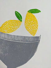 Load image into Gallery viewer, A close up of a lemon print featuring a grey bowl and two yellow lemons
