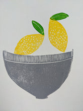 Load image into Gallery viewer, A close up of a print featuring a grey fruit bowl, two yellow lemons and two green leaves
