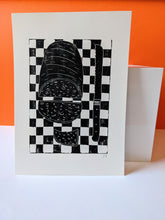 Load image into Gallery viewer, A black and white print of a loaf of bread against an orange background
