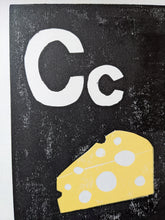 Load image into Gallery viewer, A black and yellow print of a block of cheese and the letter C
