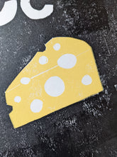 Load image into Gallery viewer, A close up of a print of a block of yellow cheese with holes in

