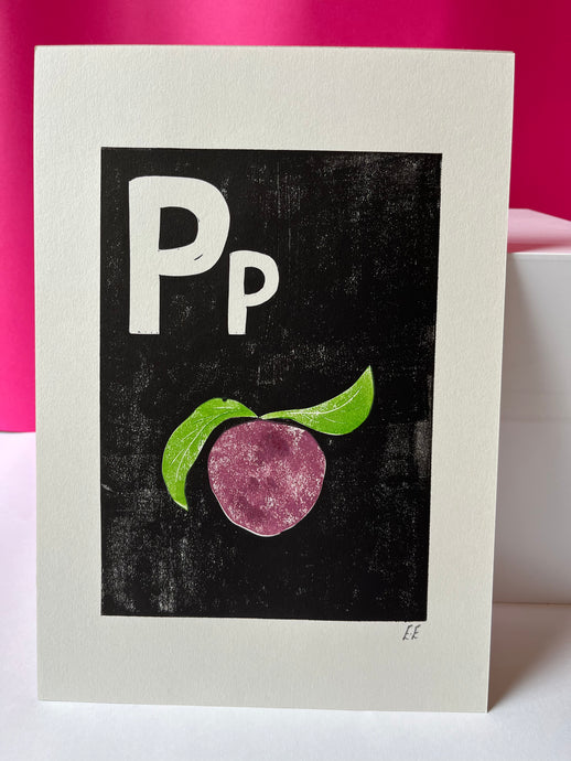 A white piece of paper with a black background and purple plum printed on it