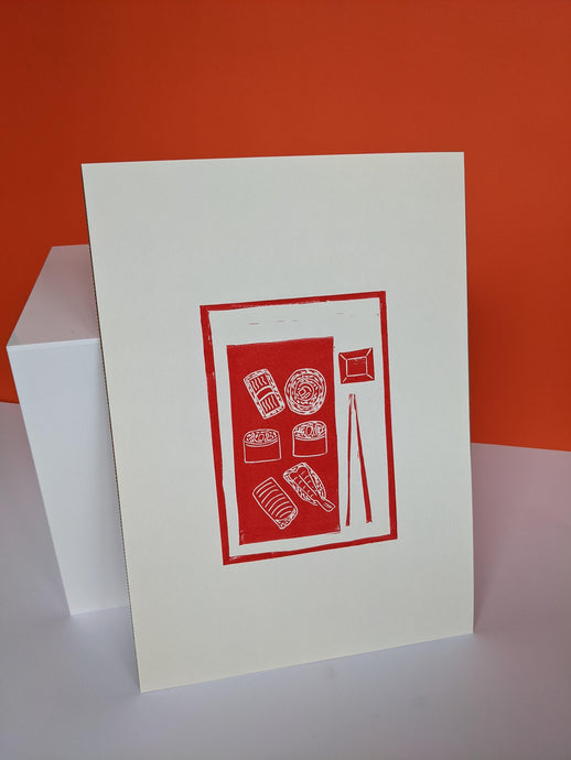 A red print of sushi, chopsticks and a small bowl