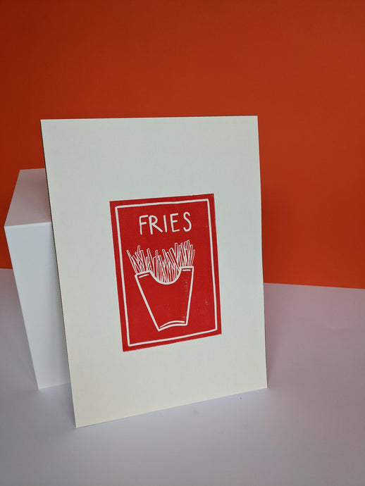 A red fries print against an orange background