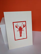 Load image into Gallery viewer, A red lobster print against an orange background
