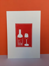 Load image into Gallery viewer, Red wine lino print on an orange background
