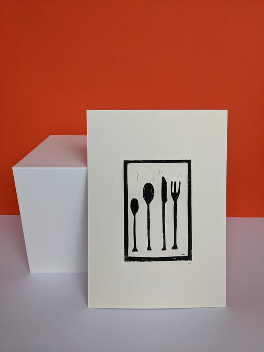 Black and white cutlery print on an orange background