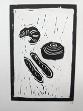 Load image into Gallery viewer, Close up of black and white pastries
