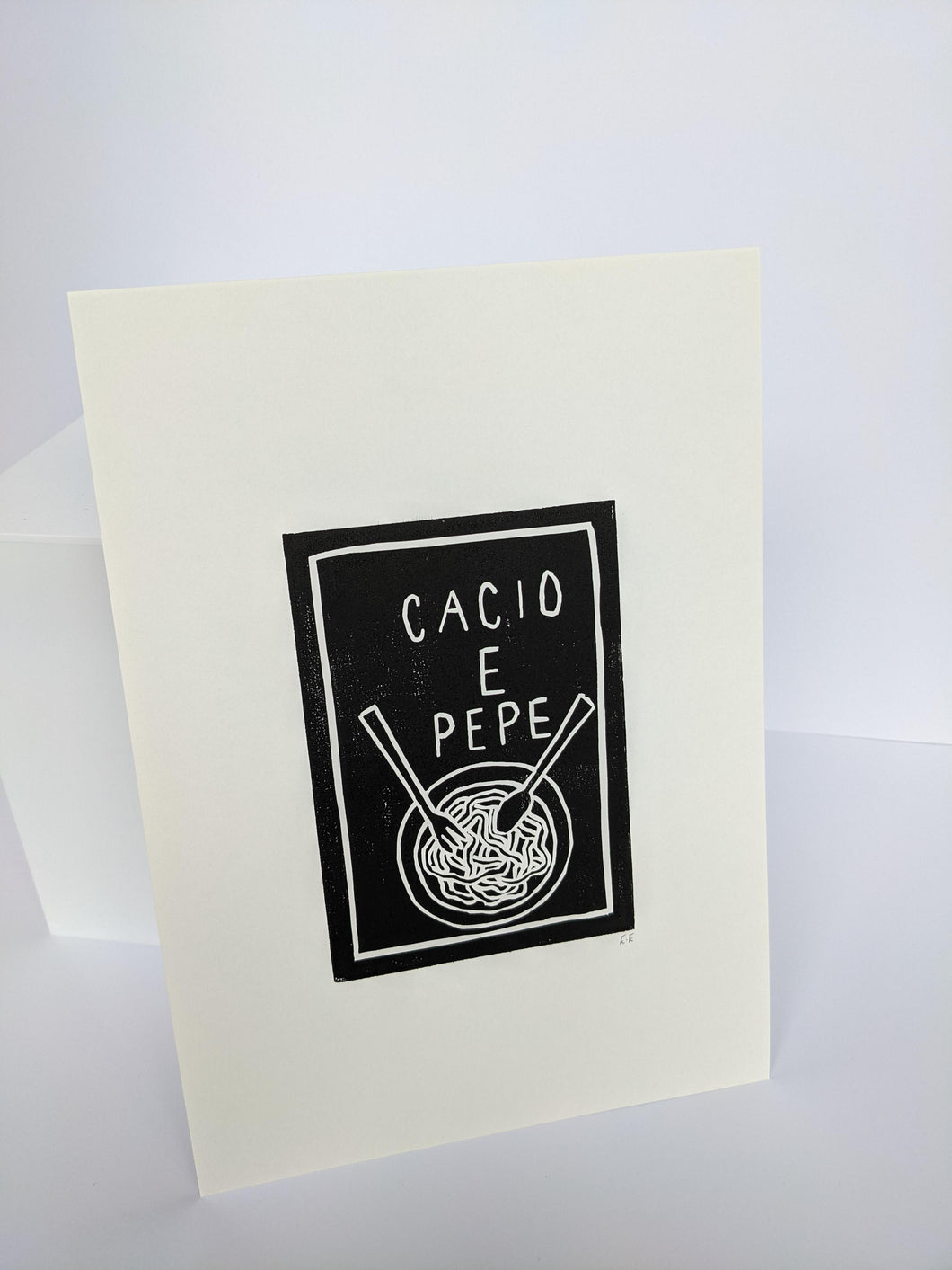Black and white cacio e pepe print on a white background