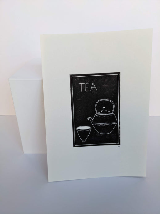 A black print of a cup of pot of tea