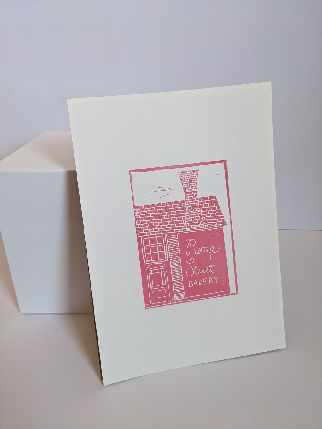 A pink Pump Street Bakery print