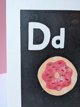 Load image into Gallery viewer, A black and white print with a pink sprinkle doughnut printed on it
