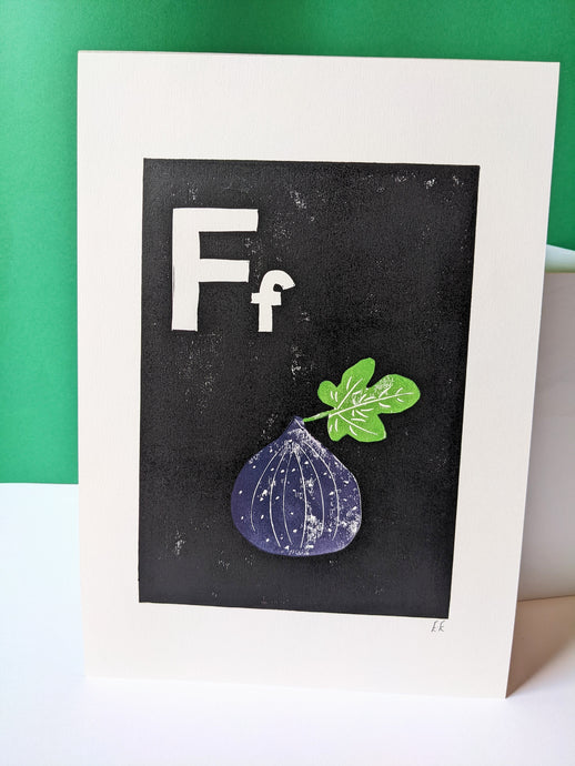 A black print with a purple fig printed on it
