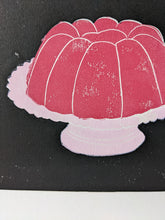 Load image into Gallery viewer, A close up of a print of a pink jelly on a pink cake stand
