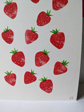 Load image into Gallery viewer, A close up of red strawberries with green tops, printed on white paper
