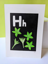 Load image into Gallery viewer, A black and green print with the letters H and green basil and sage carved out of the it
